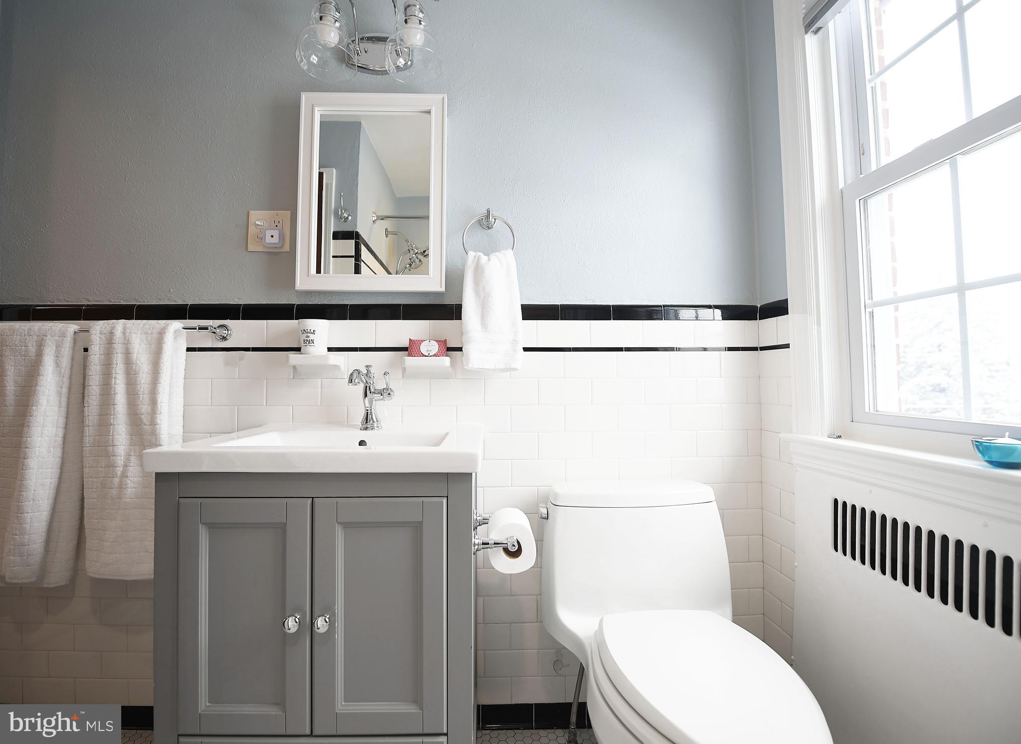 5 Murdock Road Baltimore, MD 21212 - Photo 22 of 48 a bathroom with a sink a toilet and a window