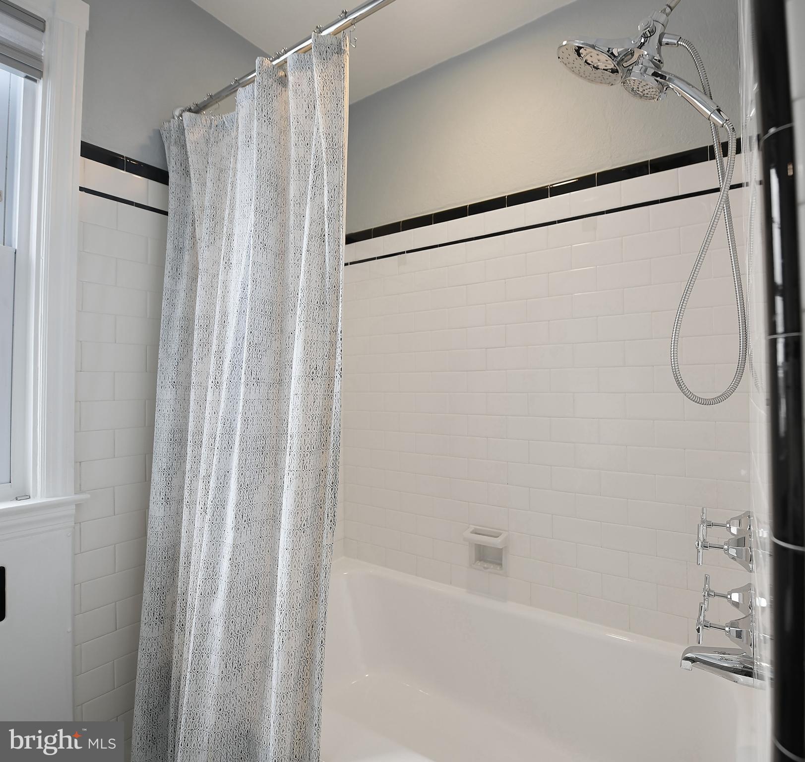 5 Murdock Road Baltimore, MD 21212 - Photo 23 of 48 a bathroom with a shower and a tub