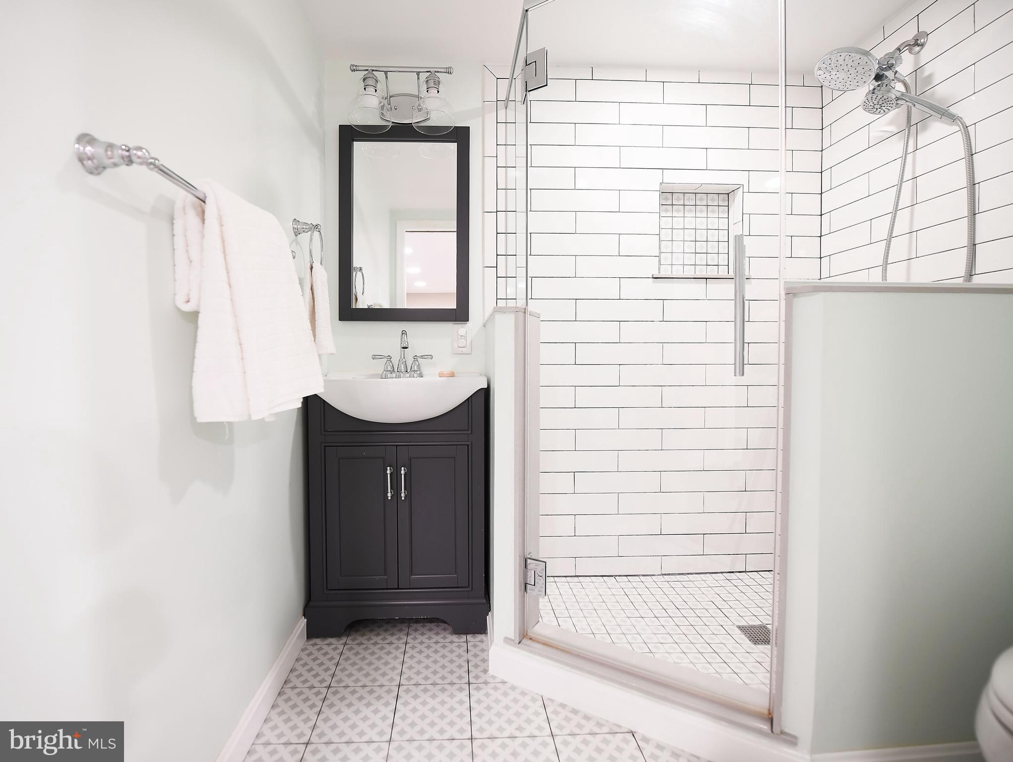 5 Murdock Road Baltimore, MD 21212 - Photo 36 of 48 a bathroom with a sink a toilet and shower