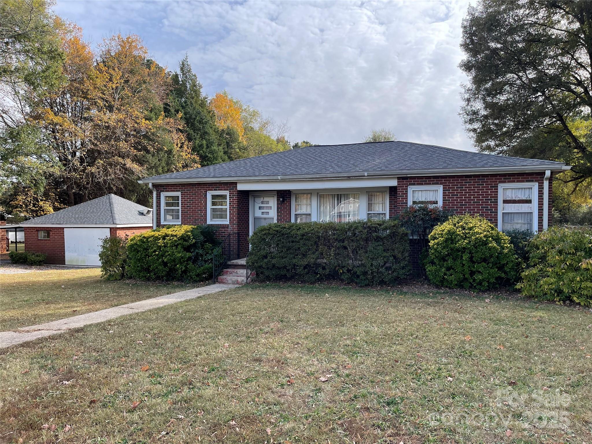 2711 Mooresville Road Salisbury, NC 28147 - Photo 1 of 18 a front view of a house with garden