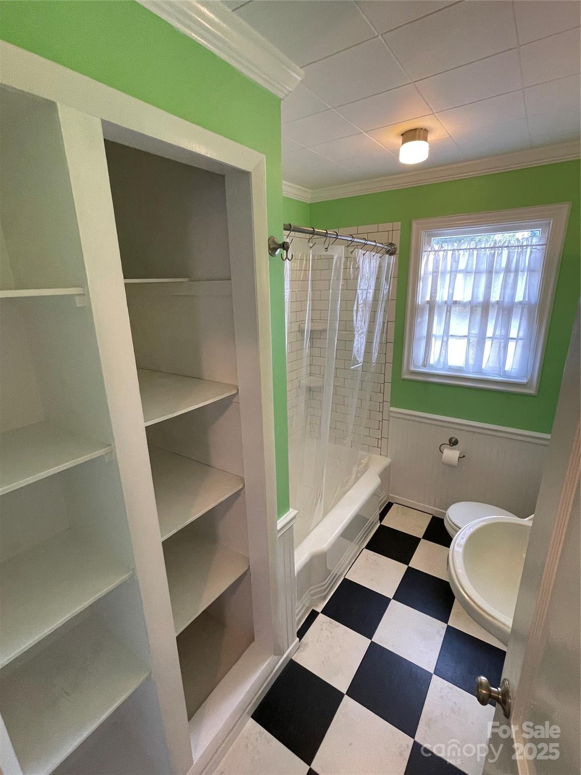 2711 Mooresville Road Salisbury, NC 28147 - Photo 11 of 18 a bathroom with a black white checkered floor and a sink