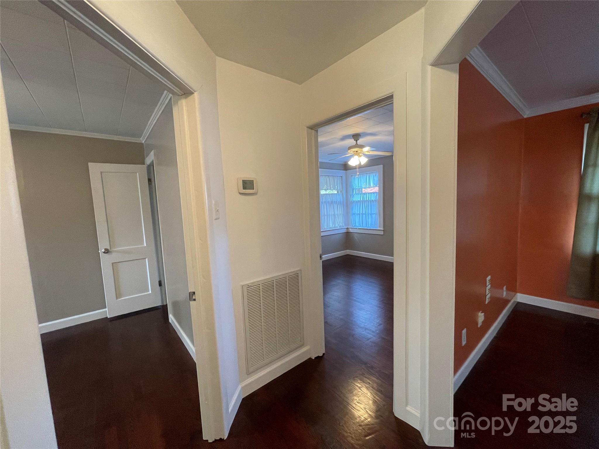 2711 Mooresville Road Salisbury, NC 28147 - Photo 13 of 18 a view of a hallway with wooden floor