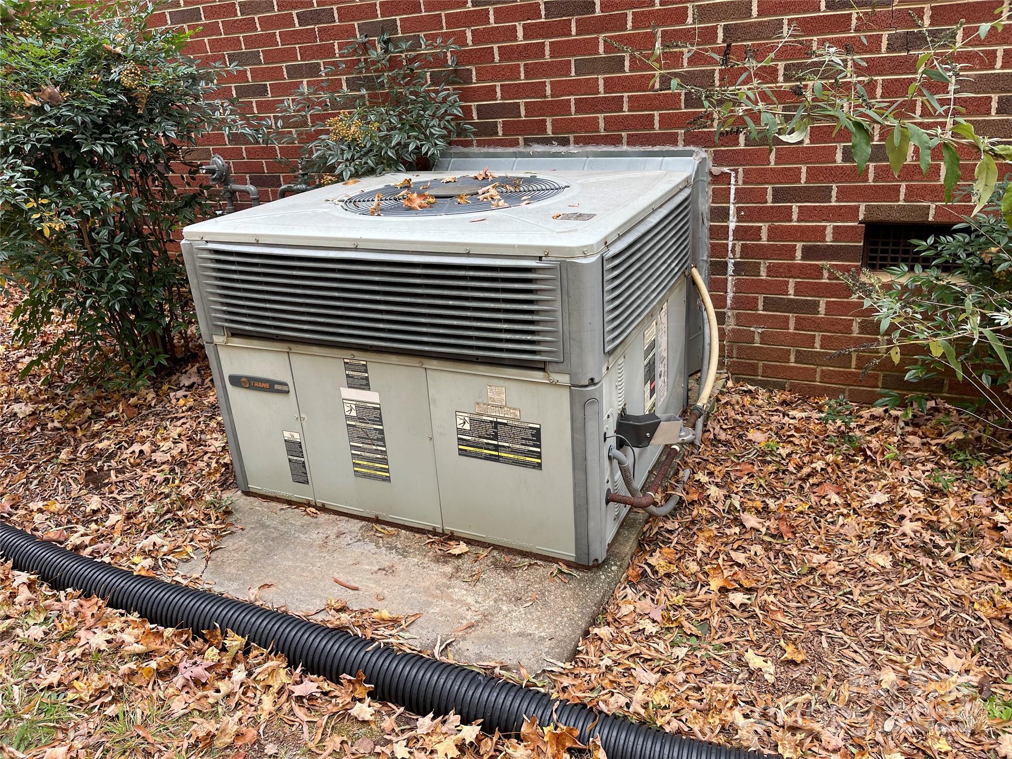 2711 Mooresville Road Salisbury, NC 28147 - Photo 16 of 18 a view of a wooden door and brick wall