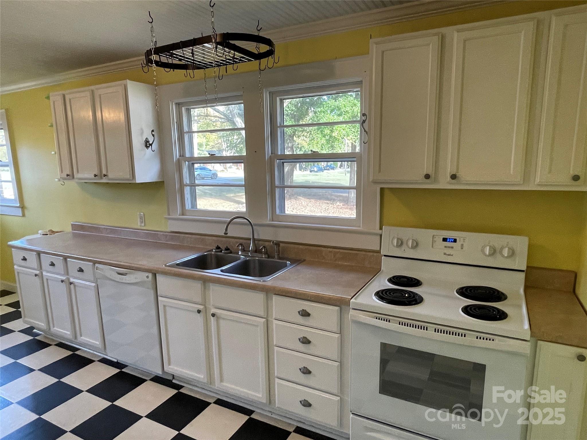 2711 Mooresville Road Salisbury, NC 28147 - Photo 7 of 18 a kitchen with a stove a sink and a refrigerator