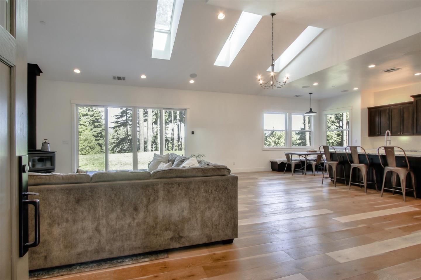 355 McKee Road Felton, CA 95018 - Photo 13 of 71 a living room with furniture and a flat screen tv