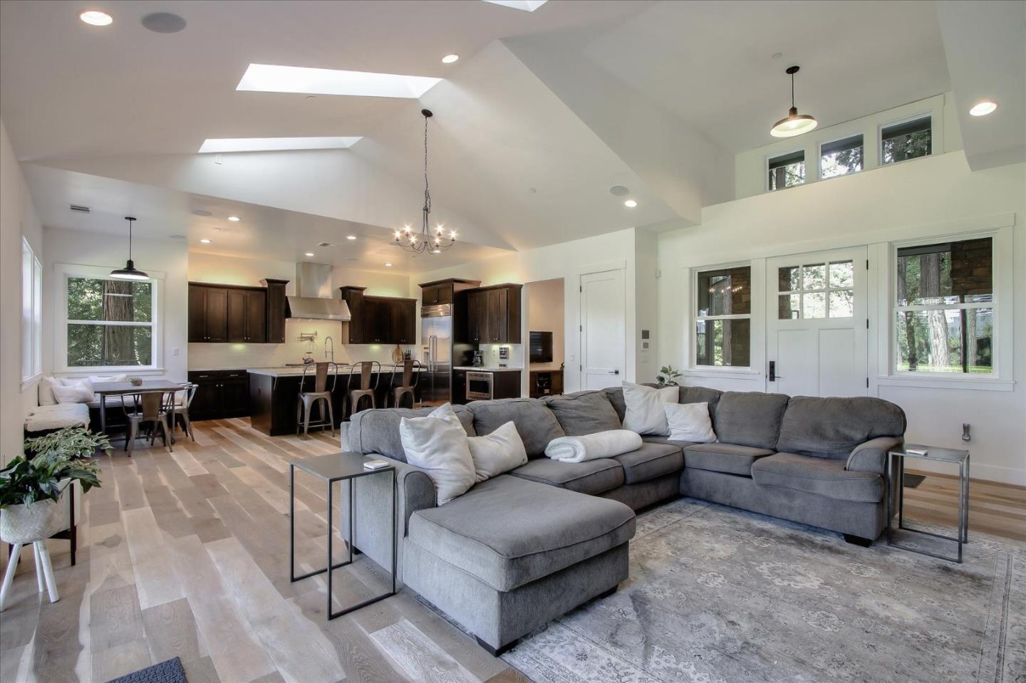 355 McKee Road Felton, CA 95018 - Photo 17 of 71 a living room with furniture kitchen view and a chandelier