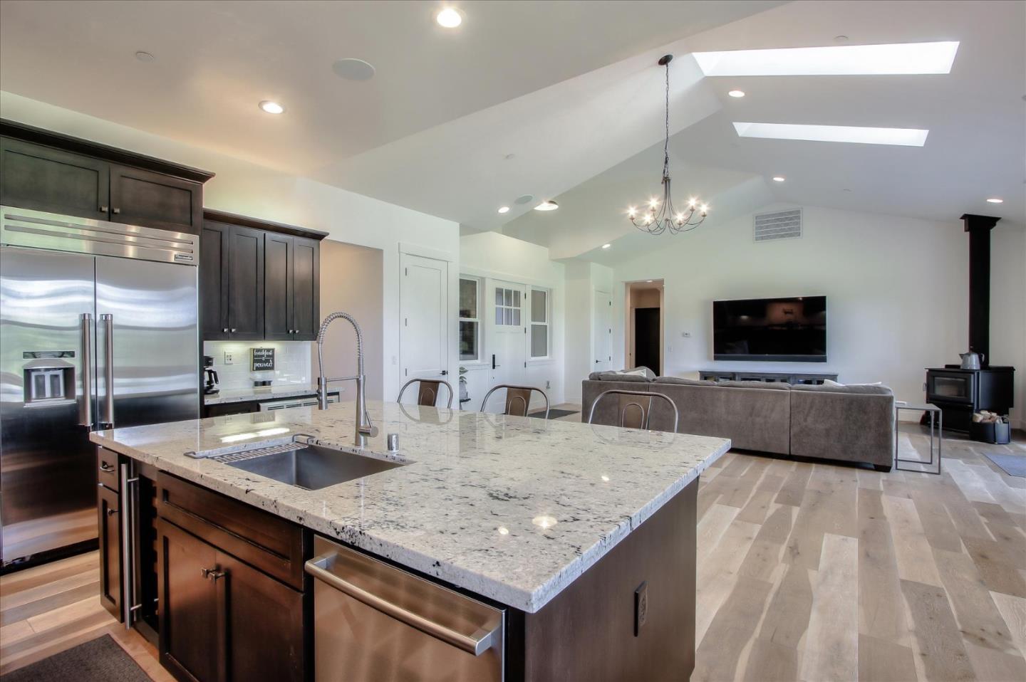 355 McKee Road Felton, CA 95018 - Photo 23 of 71 a kitchen with stainless steel appliances granite countertop a sink a stove and a wooden cabinets