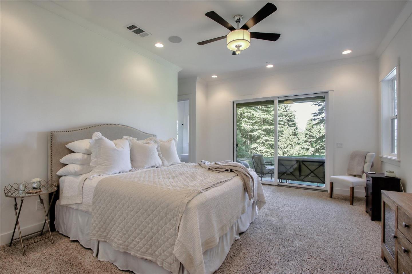 355 McKee Road Felton, CA 95018 - Photo 44 of 71 a spacious bedroom with a bed and a large window