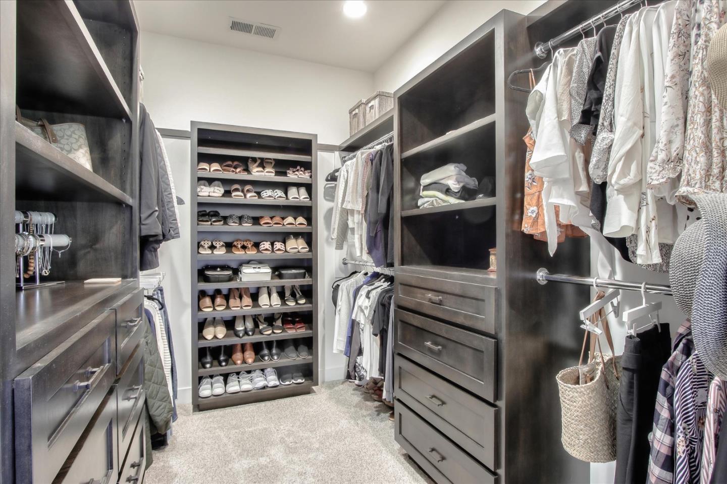 355 McKee Road Felton, CA 95018 - Photo 48 of 71 a view of walk in closet with clothes and shoes
