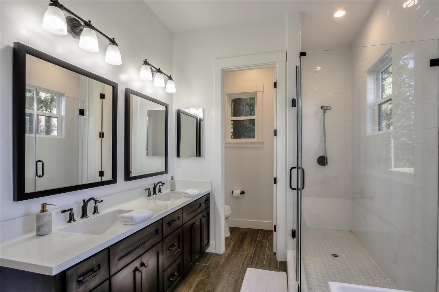 355 McKee Road Felton, CA 95018 - Photo 50 of 71 a bathroom with a double vanity sink mirror double and shower