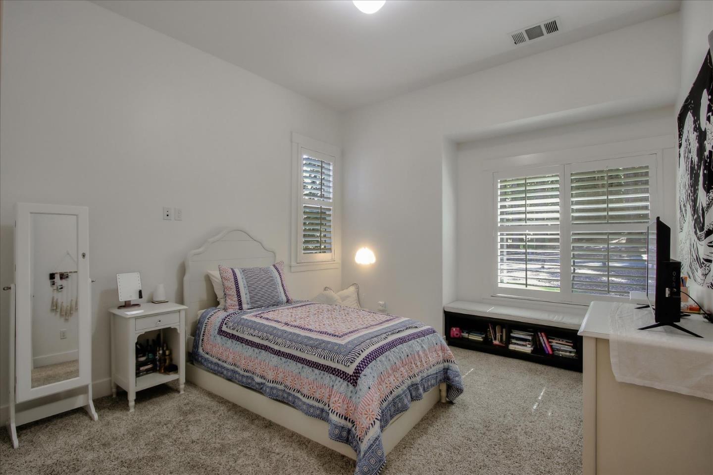 355 McKee Road Felton, CA 95018 - Photo 51 of 71 a bedroom with a bed next to a window and a couch