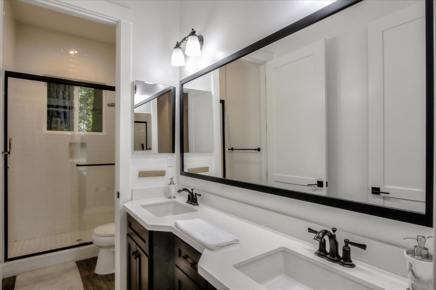 355 McKee Road Felton, CA 95018 - Photo 54 of 71 a bathroom with a sink and a mirror