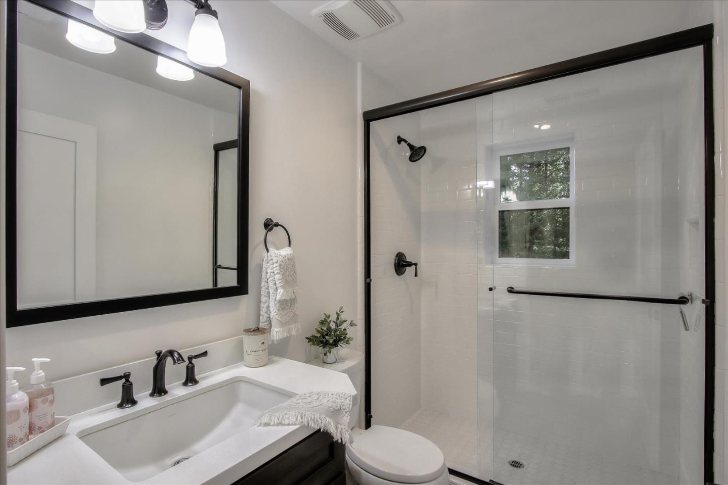 355 McKee Road Felton, CA 95018 - Photo 58 of 71 a bathroom with a sink toilet and shower