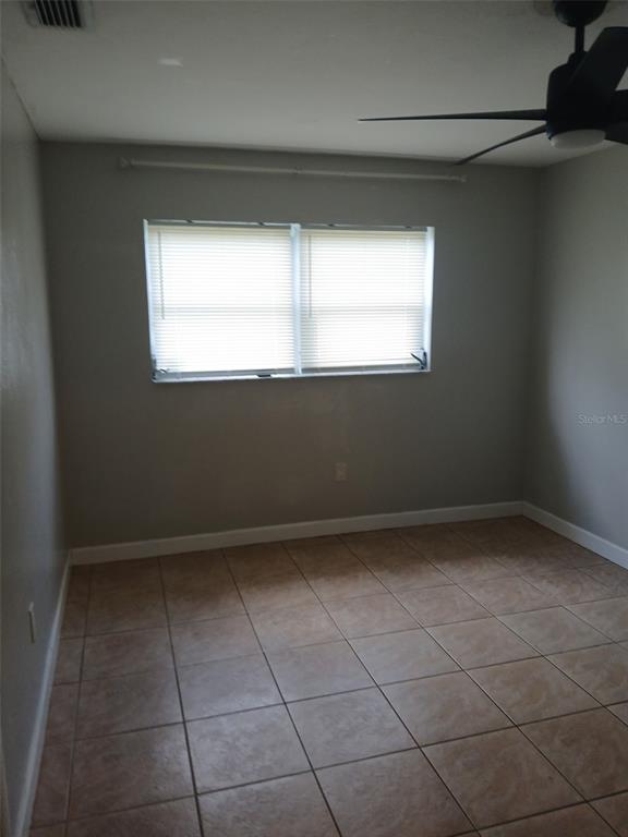 304 Venetia Avenue, Unit A North Port, FL 34287 - Photo 2 of 4 a view of an empty room with a window
