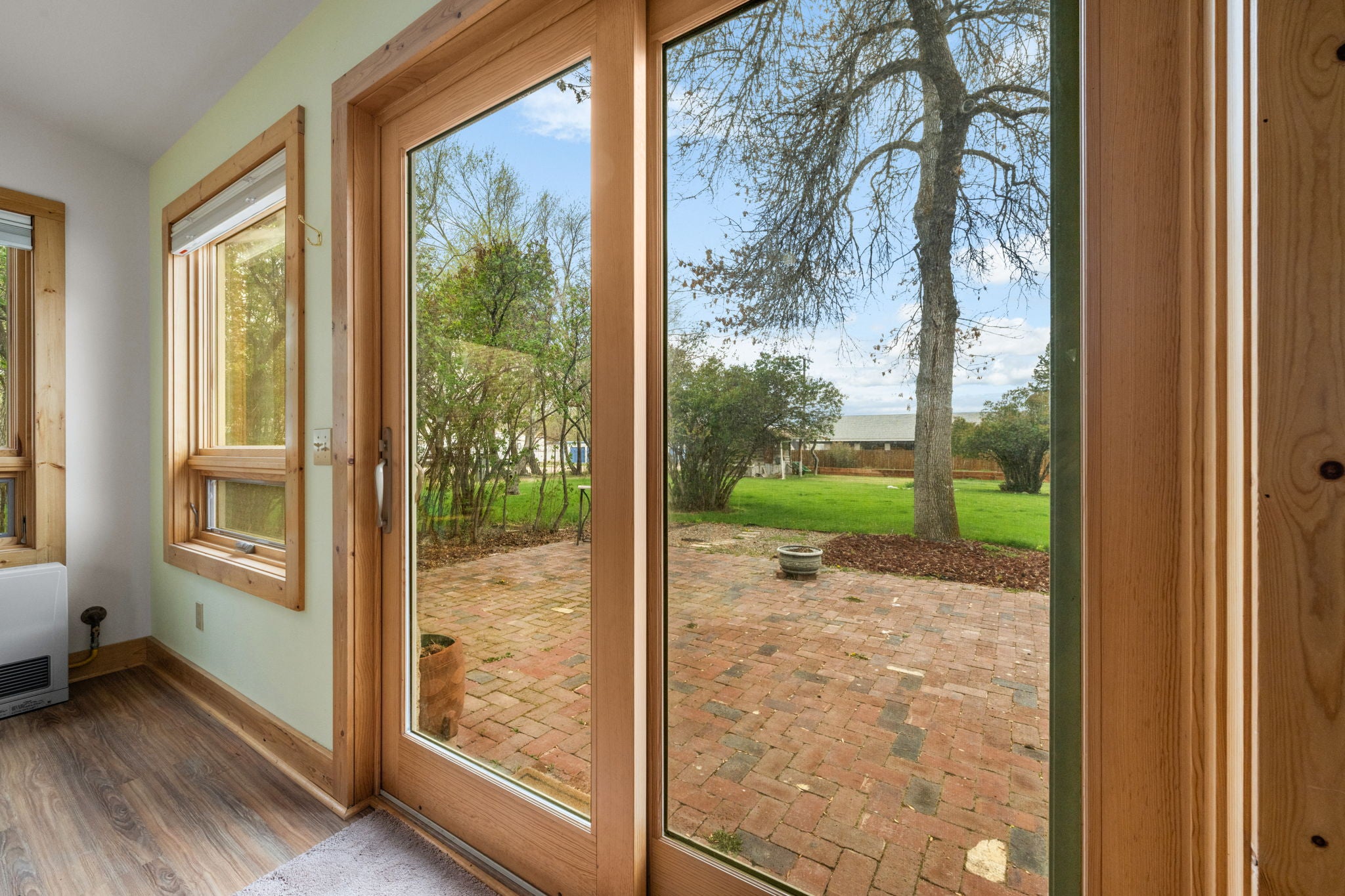 113 Poppleton Street Sheridan, MT 59749 - Photo 75 of 85 View to backyard from sunroom