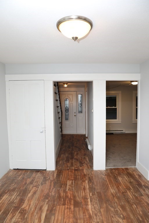 57 Springfield Street Three Rivers, MA 01080 - Photo 12 of 25 a view of a hallway with wooden floor and a bathroom
