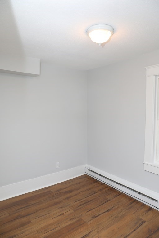 57 Springfield Street Three Rivers, MA 01080 - Photo 15 of 25 a view of an empty room with wooden floor and a window