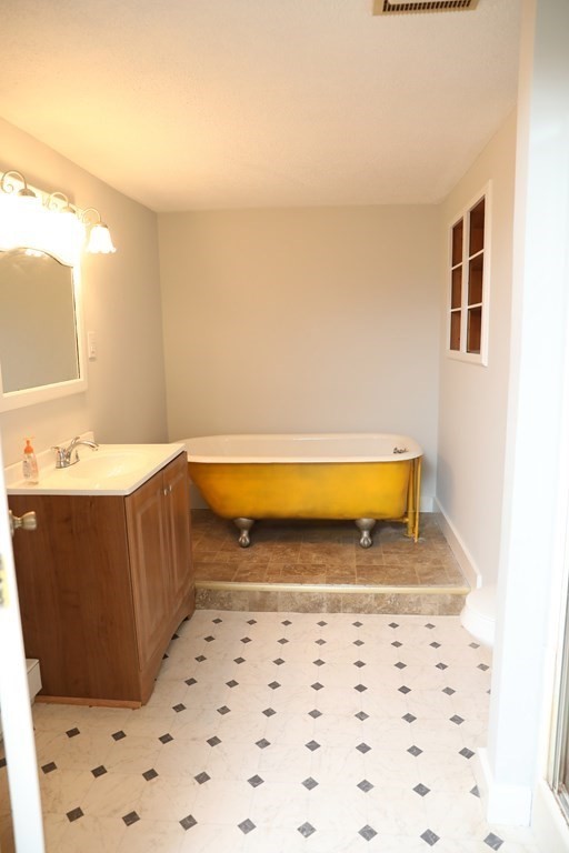 57 Springfield Street Three Rivers, MA 01080 - Photo 22 of 25 a bathroom with a bathtub and shower