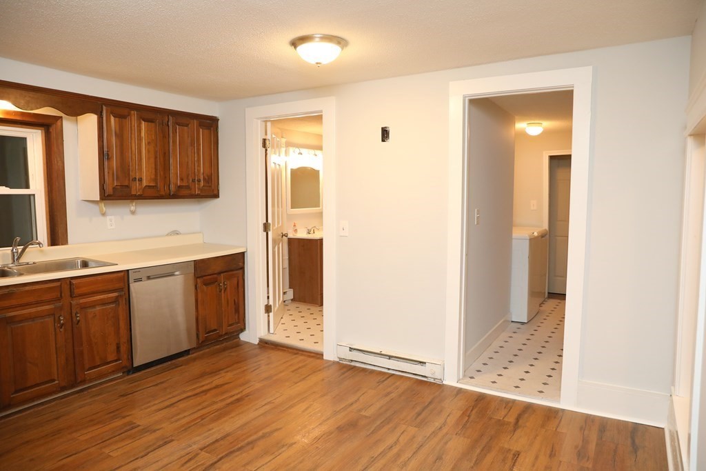 57 Springfield Street Three Rivers, MA 01080 - Photo 5 of 25 a kitchen with a refrigerator and a sink