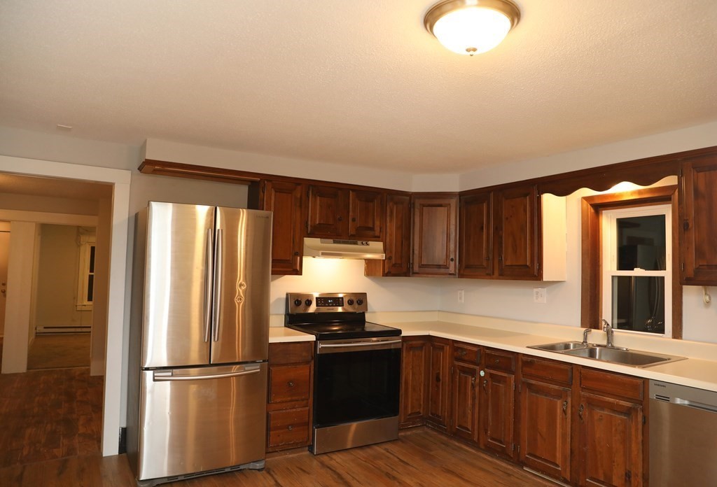 57 Springfield Street Three Rivers, MA 01080 - Photo 6 of 25 a kitchen with a refrigerator sink and cabinets