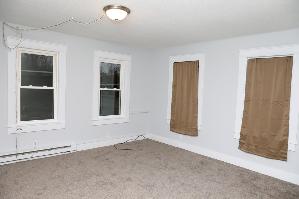 57 Springfield Street Three Rivers, MA 01080 - Photo 9 of 25 an empty room with windows