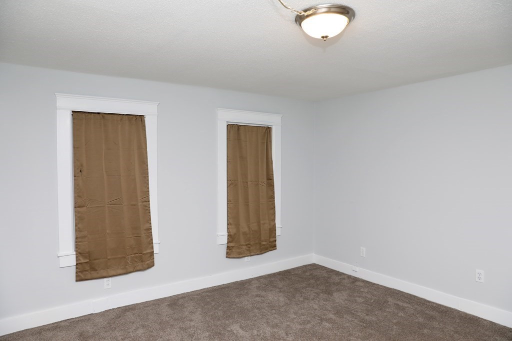 57 Springfield Street Three Rivers, MA 01080 - Photo 10 of 25 an empty room with windows