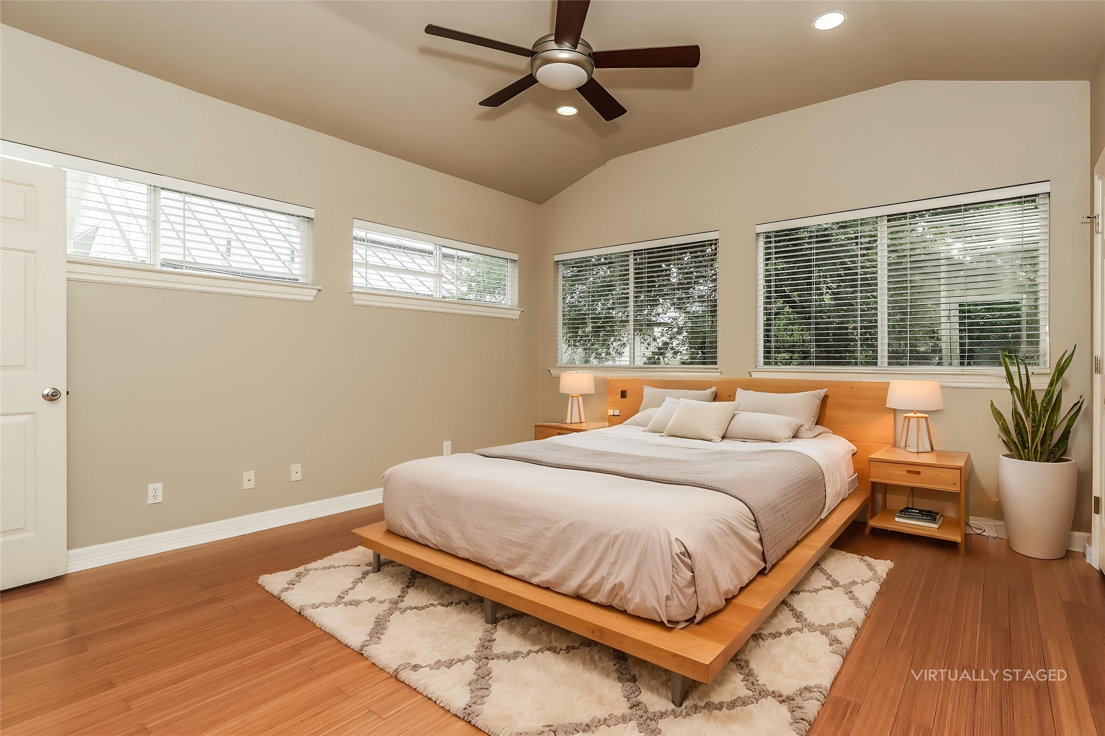 1701 Sanchez Street, Unit A Austin, TX 78702 - Photo 4 of 19 Experience tranquility in this inviting primary bedroom with vaulted ceilings and abundant natural light.