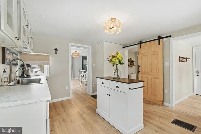a kitchen with a refrigerator and a stove