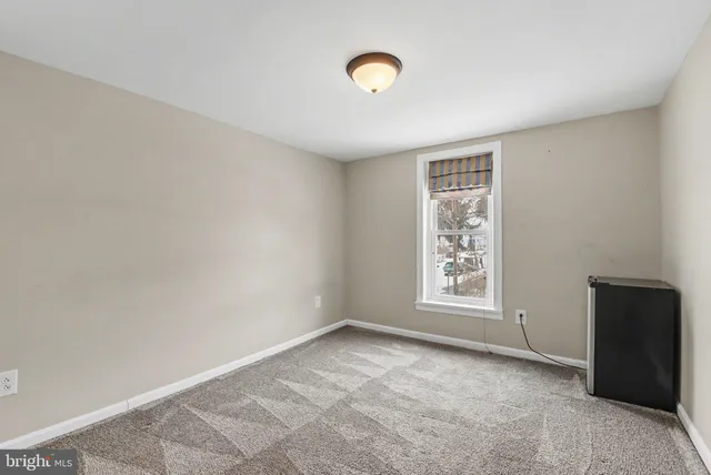 a view of a room that has a window in it