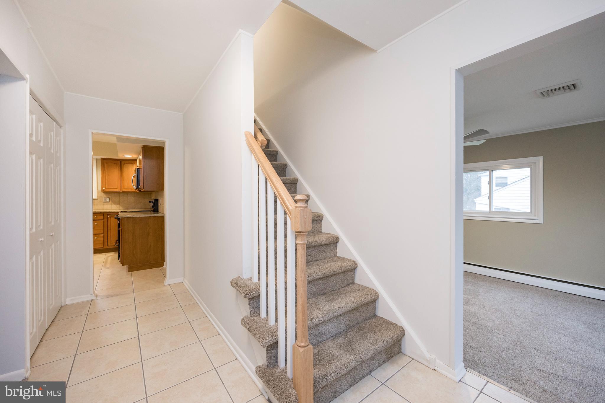 2777 Lantern Lane Audubon, PA 19403 - Photo 6 of 31 Foyer w/new railing and re-grouted tile