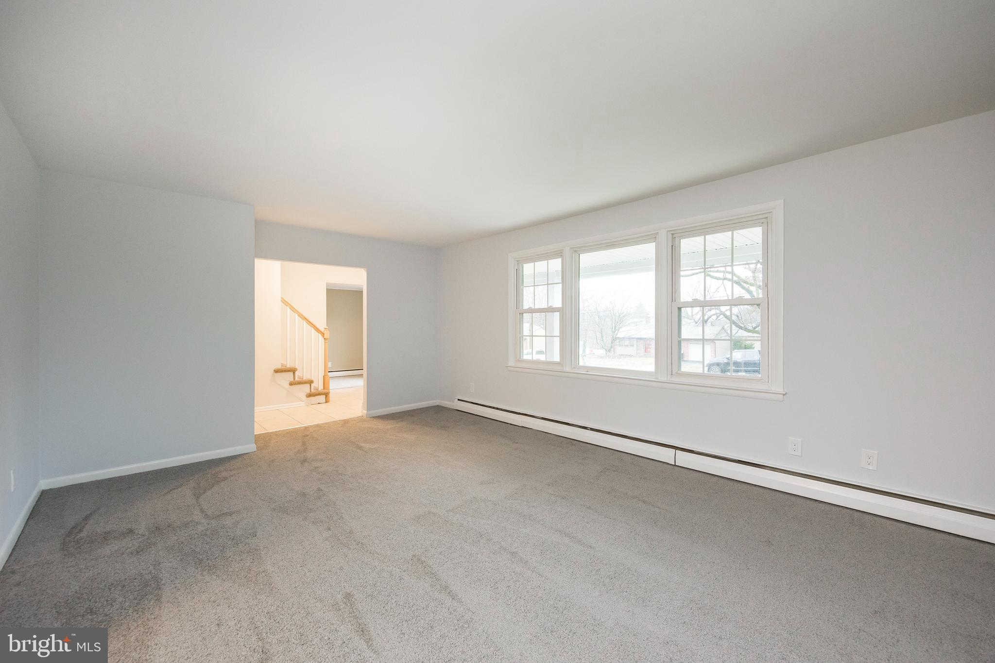 2777 Lantern Lane Audubon, PA 19403 - Photo 8 of 31 Living Room w/new carpet over hardwood flooring