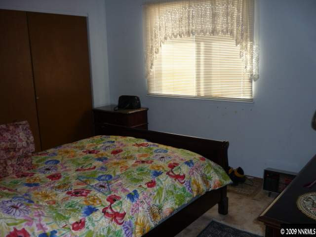 3455 Becard Lane Reno, NV 89508 - Photo 6 of 9 a bedroom with a bed and a window