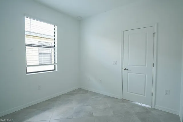 a bathroom with a granite countertop toilet a sink and a bathtub