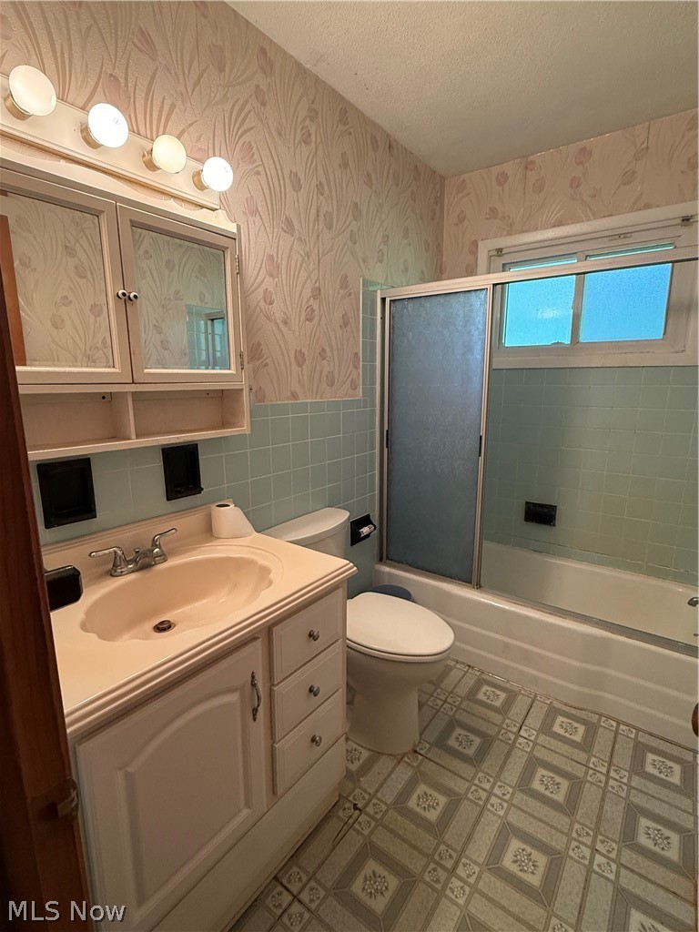 10993 Claridon Troy Road Chardon, OH 44024 - Photo 7 of 20 Bathroom featuring a white vanity with integrated sink, chrome faucet, and mirrored medicine cabinet