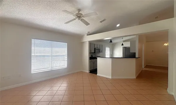 a view of a kitchen with a sink and cabinets