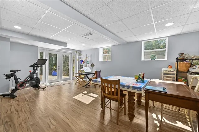 a work room with furniture and wooden floor