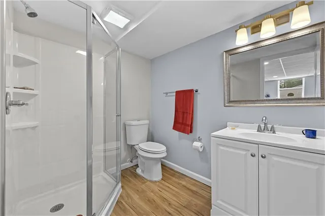 a bathroom with a toilet sink and a mirror