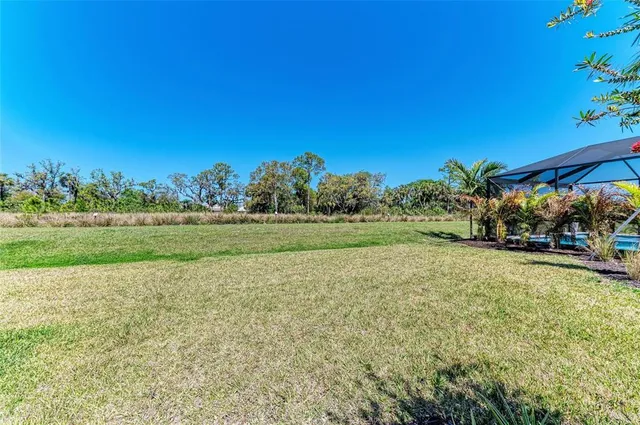 an aerial view of a house with a ocean view