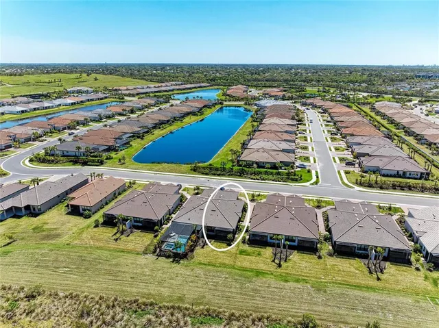 an aerial view of a house with a swimming pool