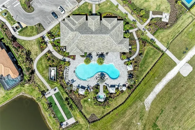 a view of a big room with wooden floor and furniture