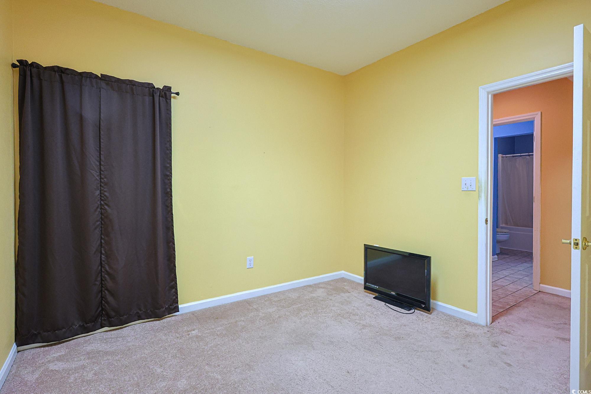 2302 Sweetwater Boulevard, Unit 2302 Murrells Inlet, SC 29576 - Photo 12 of 24 Carpeted empty room featuring baseboards