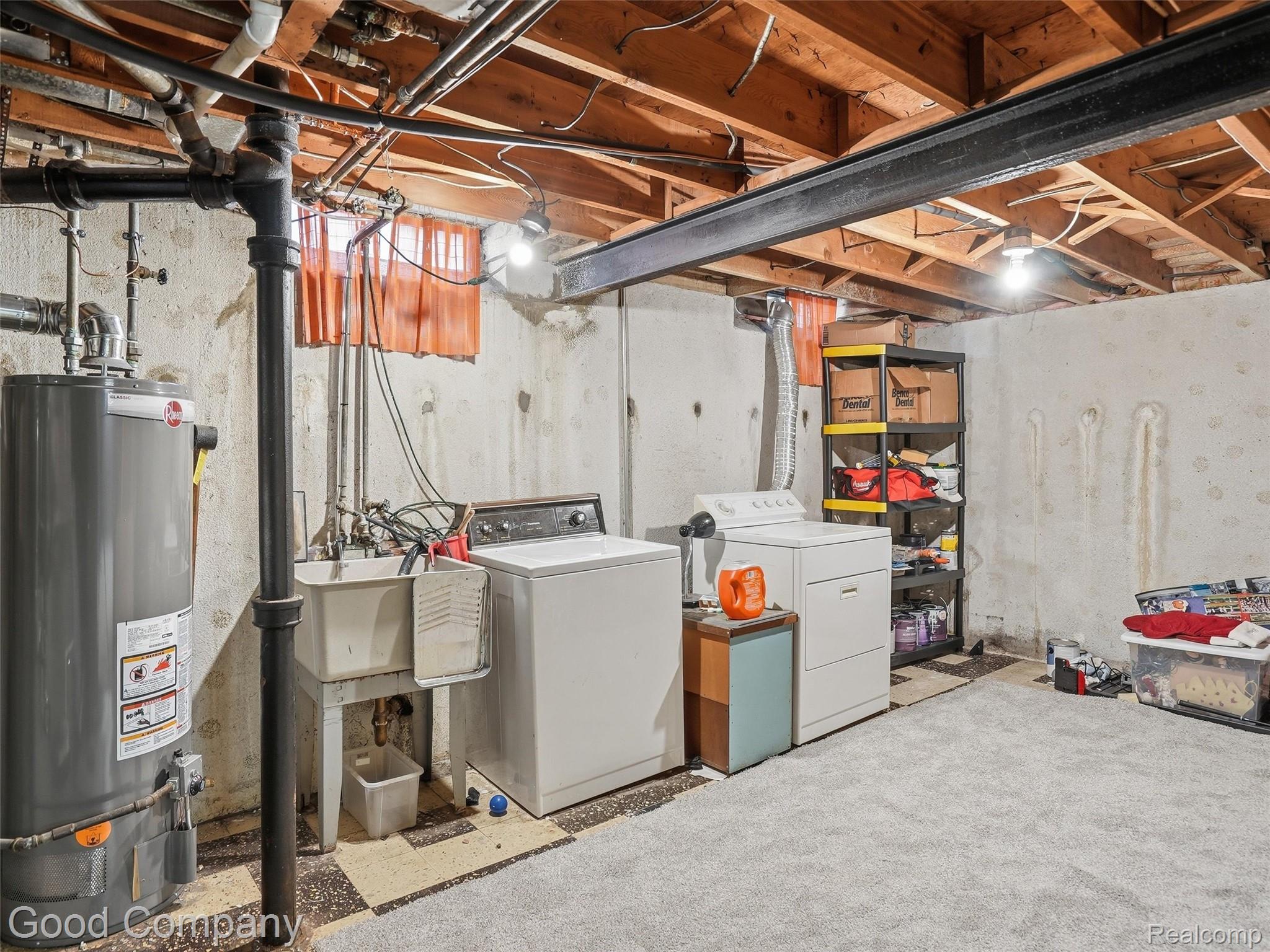 30632 Hayes Road Roseville, MI 48066 - Photo 25 of 32 Basement utility area featuring a water heater, laundry sink, and exposed ceiling joists