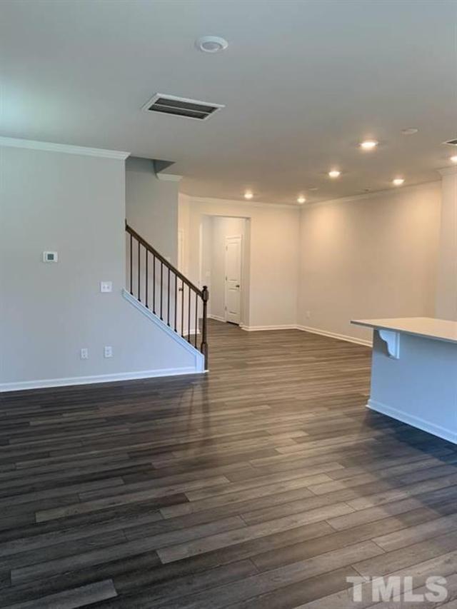 6518 Tremolo Trail, Unit C Raleigh, NC 27616 - Photo 2 of 8 a view of an empty room with wooden floor