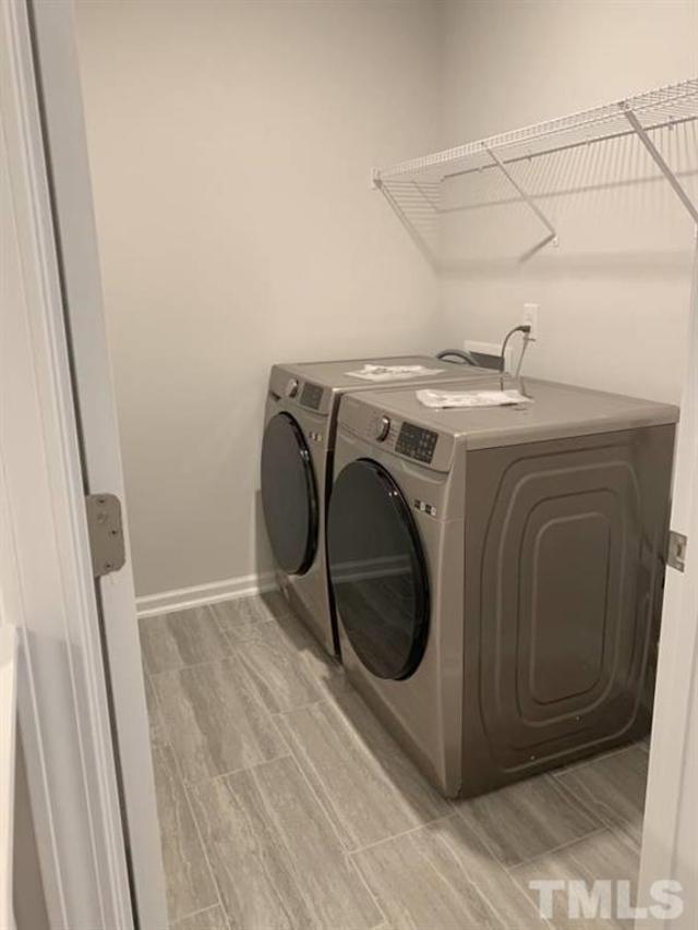 6518 Tremolo Trail, Unit C Raleigh, NC 27616 - Photo 5 of 8 a utility room with dryer and washer