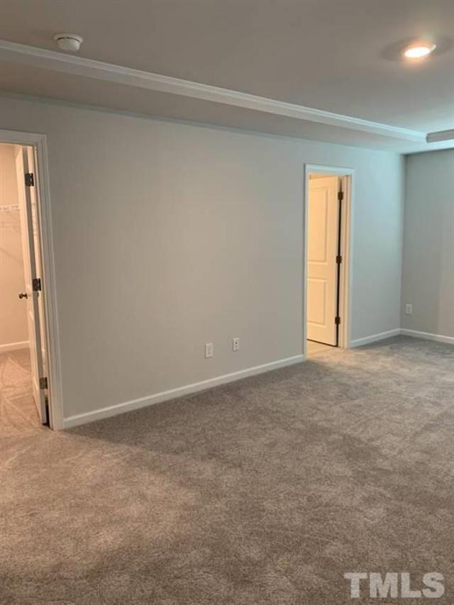 6518 Tremolo Trail, Unit C Raleigh, NC 27616 - Photo 7 of 8 a view of an empty room and window