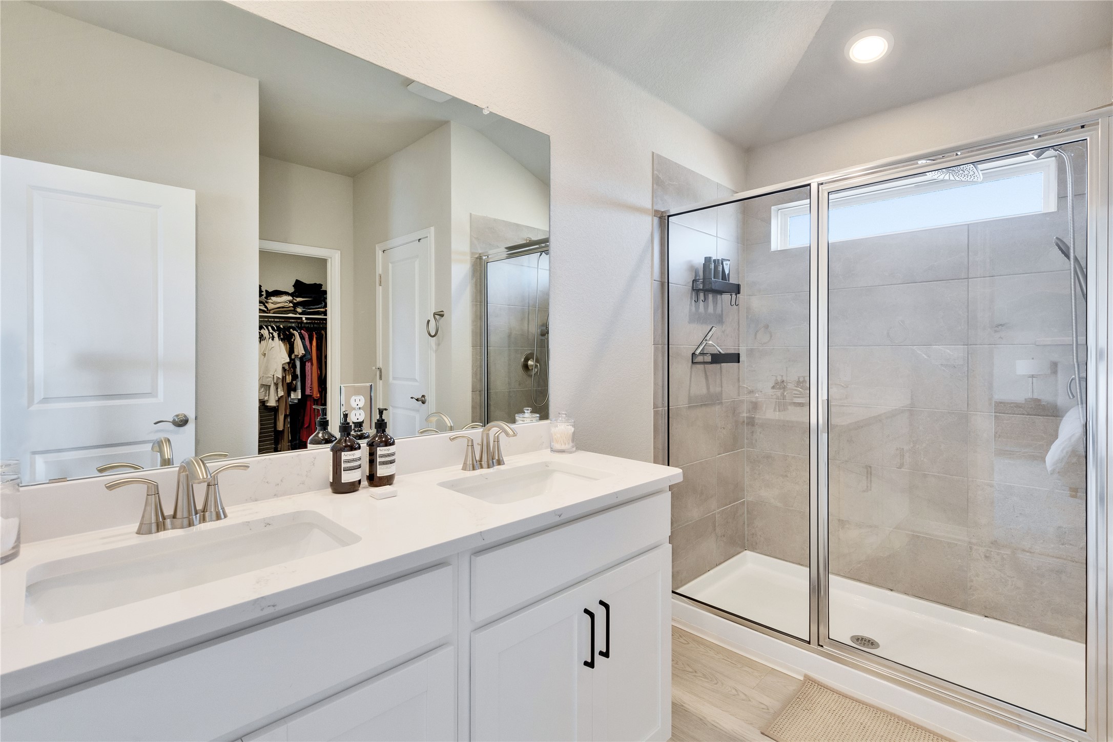 12308 Dairywork Road Buda, TX 78610 - Photo 15 of 24 The oversized walk-in shower features contemporary tile and glass doors.
