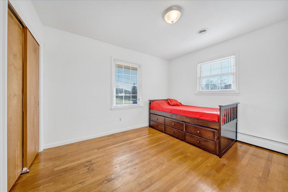 857 Olney Road Vinton, VA 24179 - Photo 13 of 45 a spacious bedroom with a bed and a window