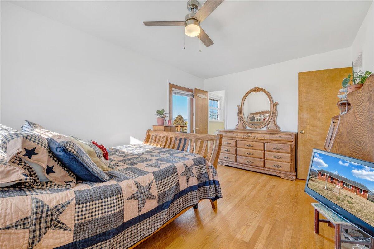 857 Olney Road Vinton, VA 24179 - Photo 16 of 45 a bedroom with a bed and a dresser