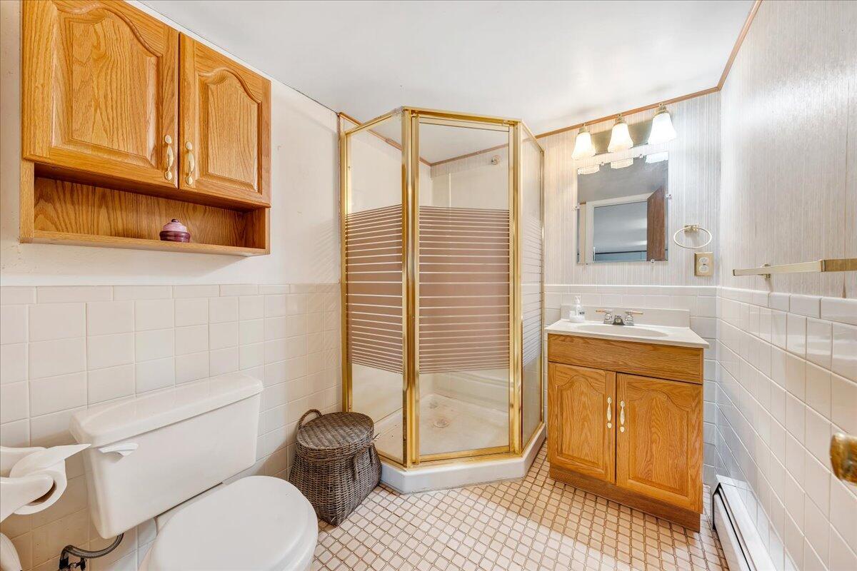 857 Olney Road Vinton, VA 24179 - Photo 17 of 45 a bathroom with a granite countertop sink mirror vanity and toilet