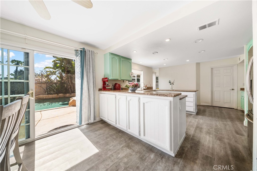 38 Carver Irvine, CA 92620 - Photo 14 of 55 a kitchen with white cabinets and a window